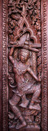 Murals, wood carvings, a Buddhist temple in Thailand.の写真素材