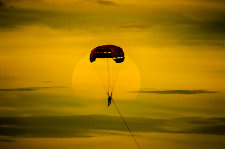 parasailing parachute on sunset at Pattaya beach Thailandの写真素材
