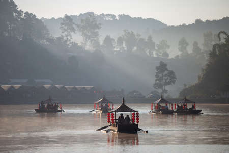Chinese boating in the morning and fog floating on the water at Ban Rak Thai.の写真素材