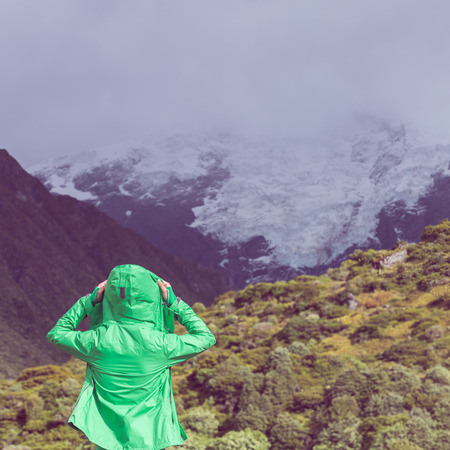 female hiker put on jacket.  の写真素材