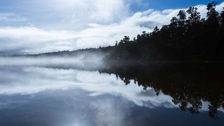 Reflection on the Lake surface in the morningの写真素材