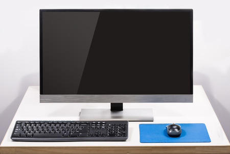 desktop computer with screen glare isolated on white backgtound