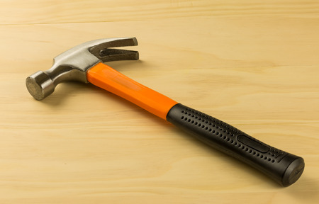 Hammer on wood tableの写真素材