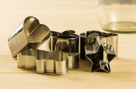 Detail of various cookies cutters on wood tableの写真素材