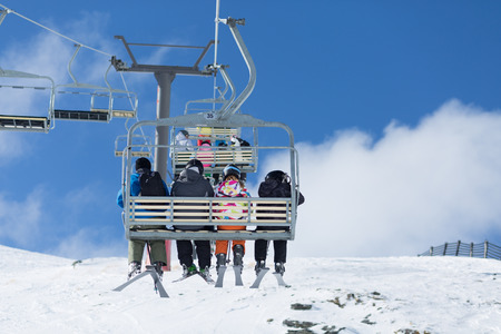 QUEENSTOWN, NEW ZEALAND - AUGUST 6: Unidentified skiers  ride the ski chair lift up the Remarkables Ski Area on August 6 2015 in Queenstown, South Island, New Zealandのeditorial素材