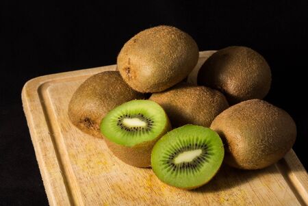 still life image of Kiwi fruit isolated on black backgroundの写真素材