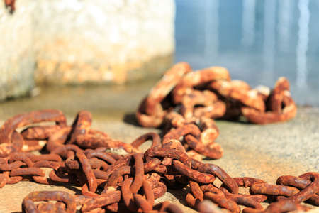 Rusty chains with habor backgroundの写真素材