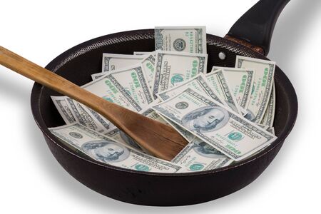 Money in used Non stick frying pan isolated on whiteの写真素材