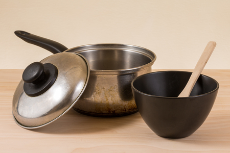 used pot on wooden tableの写真素材