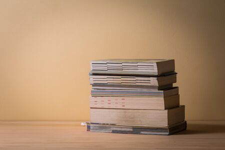 pile of books on wooden tableの写真素材