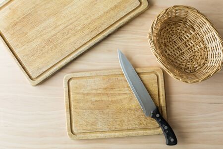 kitchen knife on wooden cutting boardの写真素材
