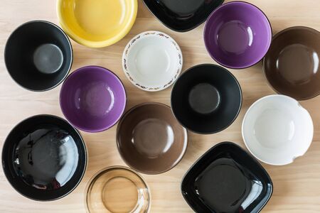 set of bowls on wooden backgroundの写真素材