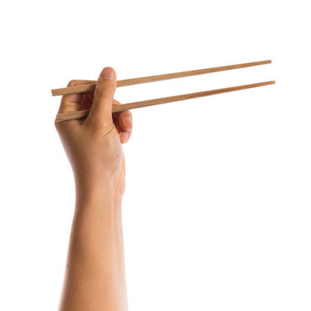 hand hold chopsticks isolated on white backgroundの写真素材