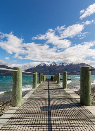 wooden pier by the lakeの写真素材