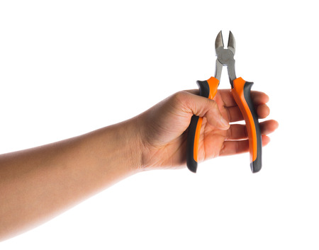 hand holding combination cutting pliers isolated on whiteの写真素材