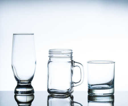 set of glasses on glass tableの写真素材