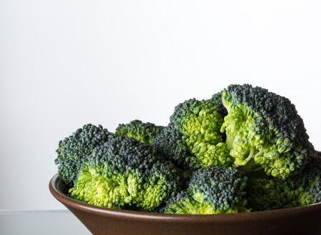 close up image of broccoli in brown bowlの写真素材