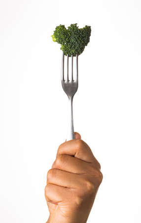 broccoli on fork isolated on white backgroundの写真素材