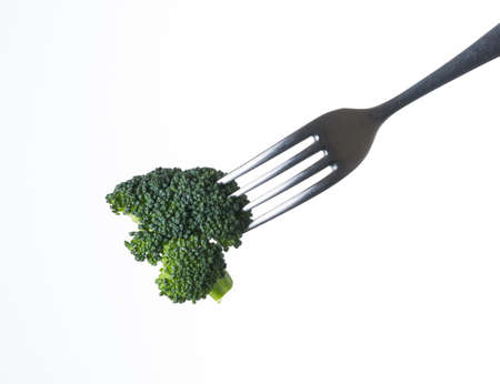 broccoli on fork isolated on white backgroundの写真素材