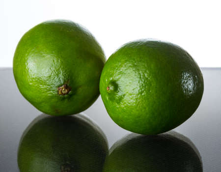 green lime on glass tableの写真素材