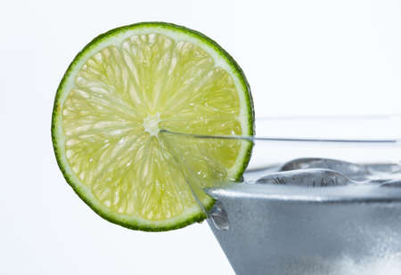 slice of lime on martini glassの写真素材