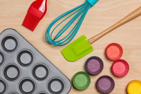 kitchen utensils for making muffins on wooden tableの写真素材