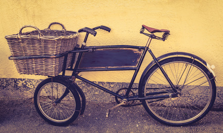 An old fashioned delivery bicycle filtered in vintage styleの写真素材