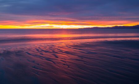 sunrise at Golden Bay in New Zealandの写真素材