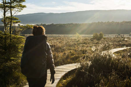 woman hiking at kepler track in Te Anau, New Zealandの写真素材