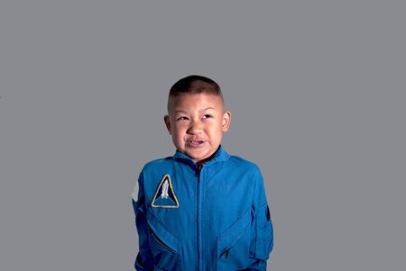 Little boy astronaut in space suit. Boy in blue astronaut suit.The kids' dream jobs.の写真素材