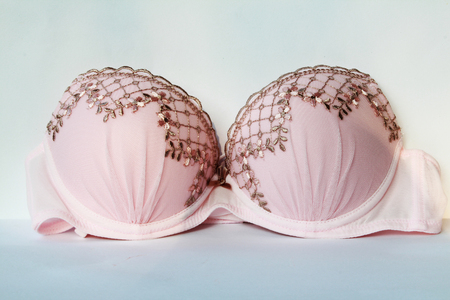 Pink bra on white backgroundの写真素材