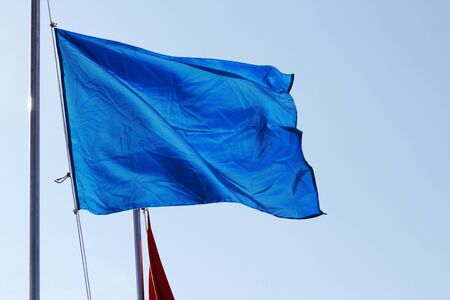 Blue flag on blue の写真素材