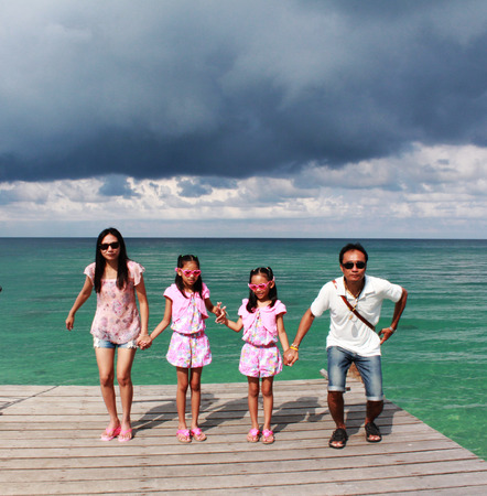 My family are happy on the sea in Thailandの写真素材