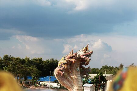 The serpent statue on the blue backgroundの写真素材