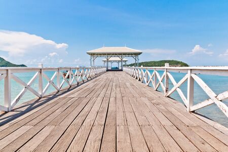 The white bridge stretching to the seaの写真素材