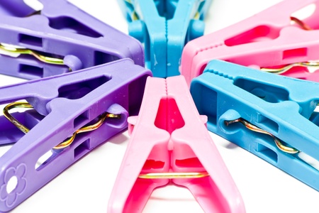 The multi-colored clothes pin on white backgroundの写真素材