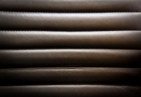 Black leather seats are welded to horizontal sutureの写真素材