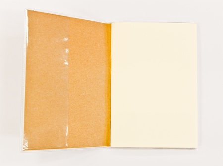 The notebook open on the floor whiteの写真素材