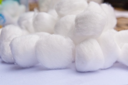 A cotton ball several overlapping pieces on write backgroundの写真素材