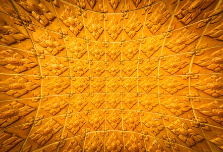 Thai golden temple wall with a flower patternの写真素材