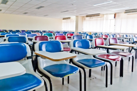 Multi colored chairs arranged in the roomのeditorial素材