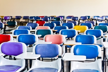 Multi colored chairs arranged in the roomのeditorial素材