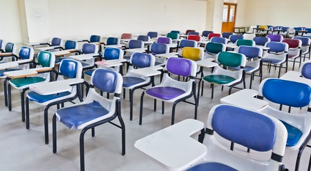 Multi colored chairs arranged in the roomのeditorial素材