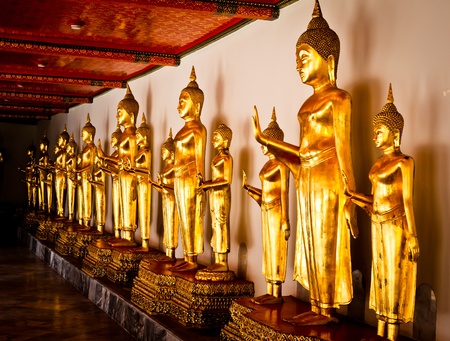 Golden Buddha stands in the temple