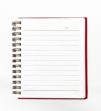 Notebook red on a white background isolatedの写真素材