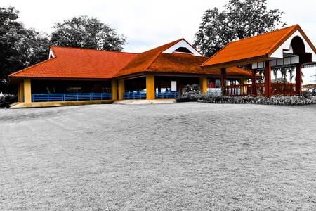 The red house on green lawn In the parkのeditorial素材