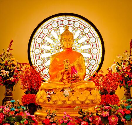 Golden Buddha sitting on a lotusのeditorial素材