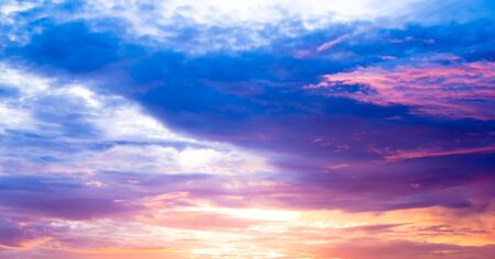 The sky at sunset, beautiful light and colorの写真素材