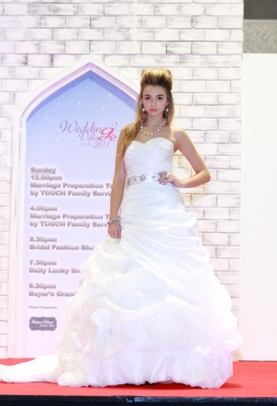 Wedding Village December 6 8th Dec  2013 is Singapores Largest Thematic Wedding Exhibition in Singapore   Exclusive Bridal Show with models strutting down the runway, donning beautiful Wedding and Evening Gowns provided by The Gown Warehouse  There is alのeditorial素材