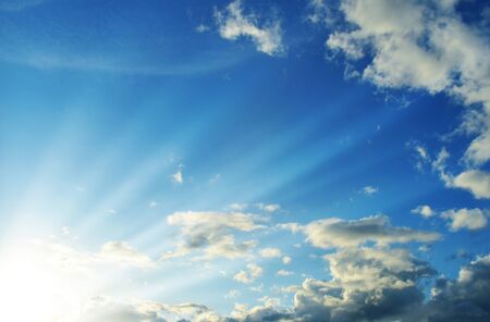 Blue sky with clouds and sun light.の写真素材